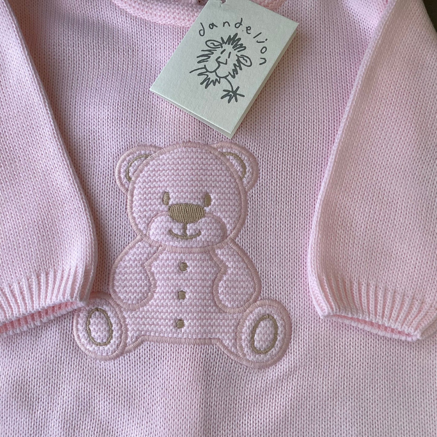 Dandelion pink knitted onesie